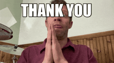 a man in a red shirt is praying with the words thank you above him