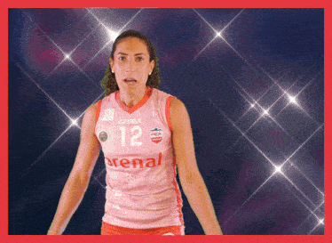 a female volleyball player wearing a jersey that says arenal on it