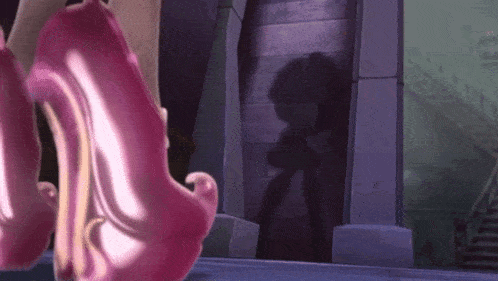 a woman wearing a pair of pink high heels is walking down a street