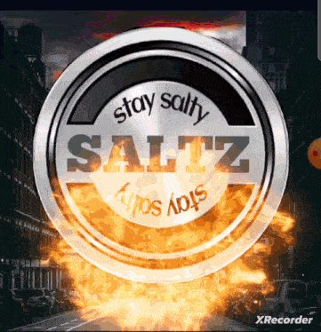 a can of stay salty saltz is surrounded by fire