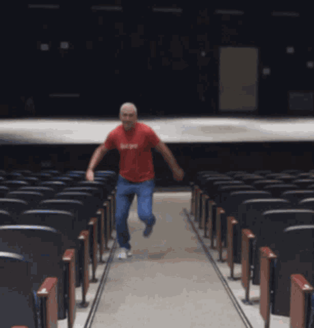 a man in a red shirt that says hope is running