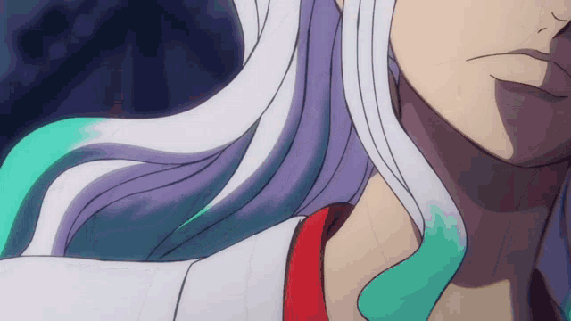 a close up of a person 's face with purple hair