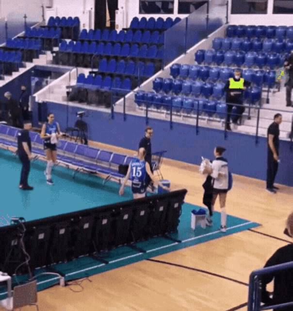 a female volleyball player with the number 15 on her back