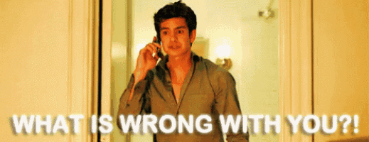 a man talking on a cell phone with the words " what is wrong with you " written below him