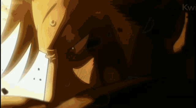 a close up of a person 's face in a dark room with a light coming out of it .