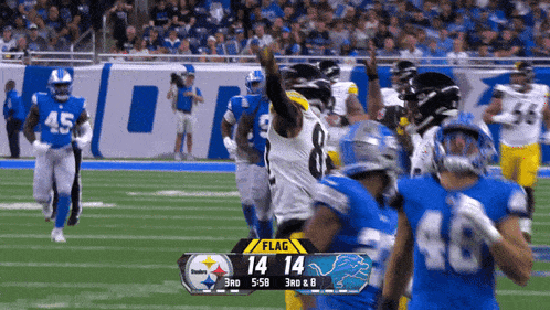 a football game is being played and the score is 14 to 14