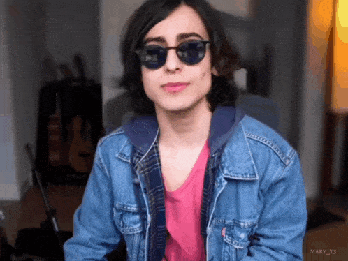 a young man wearing sunglasses and a denim jacket has the name mary_t3 on the bottom right