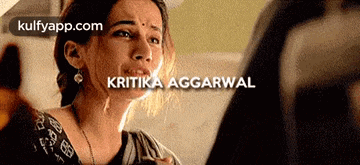 a woman is crying with the words kritika aggarwal written above her