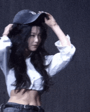 a woman wearing a hat that has the letter d on it