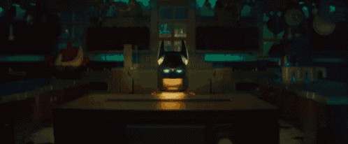 a lego batman helmet is sitting on a table