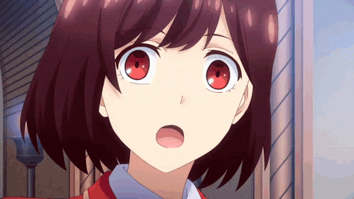 a close up of a girl 's face with a surprised look on her face