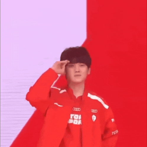 a young man wearing a red jacket with the letters idc on it