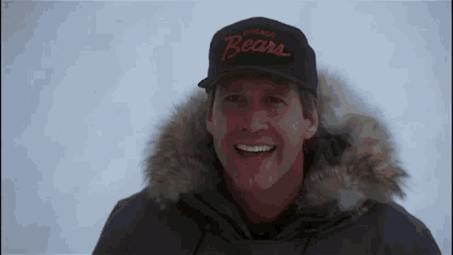 a man wearing a hat that says chicago bears on it