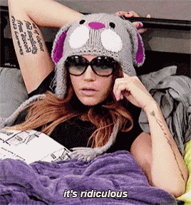 a woman wearing a bunny hat and sunglasses says it 's ridiculous .