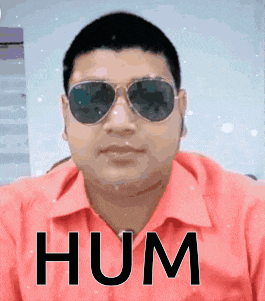 a man wearing sunglasses and a red shirt with the word hum written on it