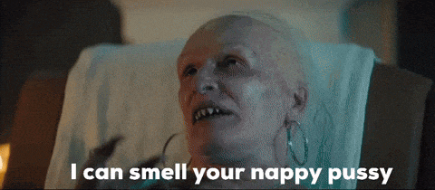 a woman with a bald head is laying in a chair and says i can smell your nappy pussy
