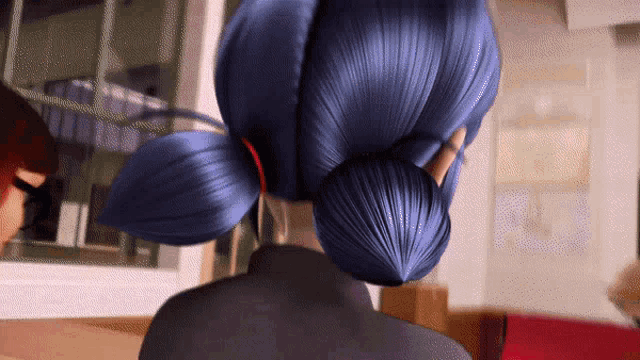a woman with blue hair is standing in a room with a man .
