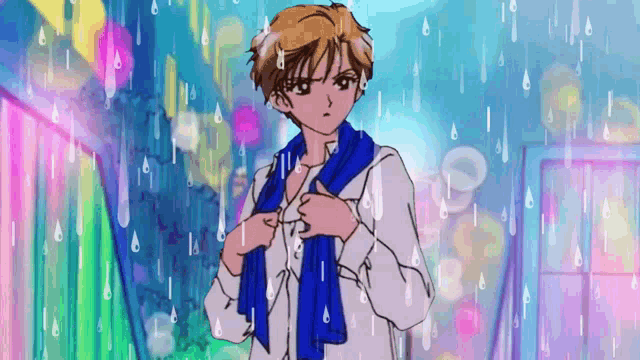 a man with a blue scarf around his neck is in the rain