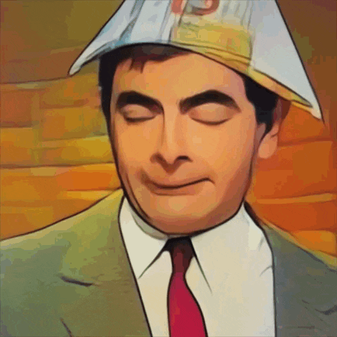 a man in a suit and tie is wearing a paper hat with the letter s on it