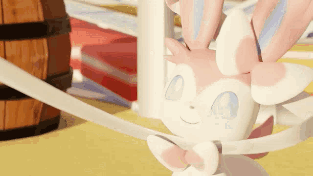 a pink and white pokemon with blue eyes and a bow tie