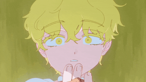 a close up of a person 's face with yellow hair