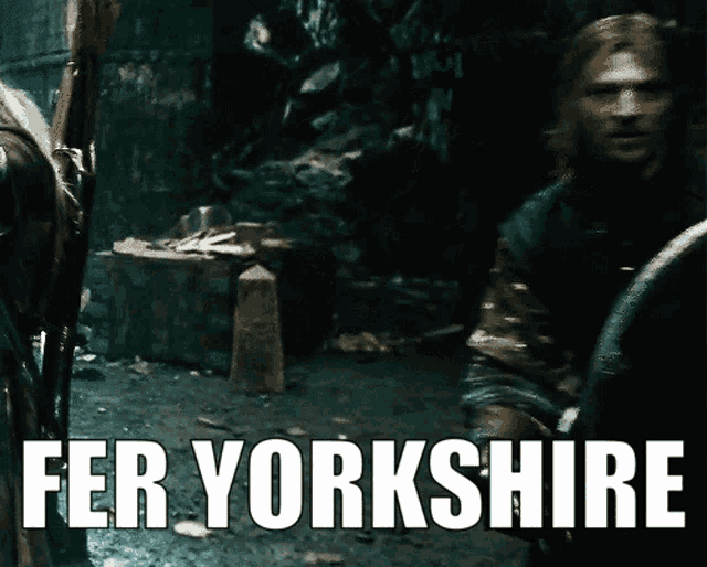 a poster that says fer yorkshire with a man standing in the background