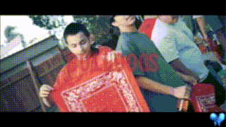 a group of young men holding a red bandana with the word hoods on the front