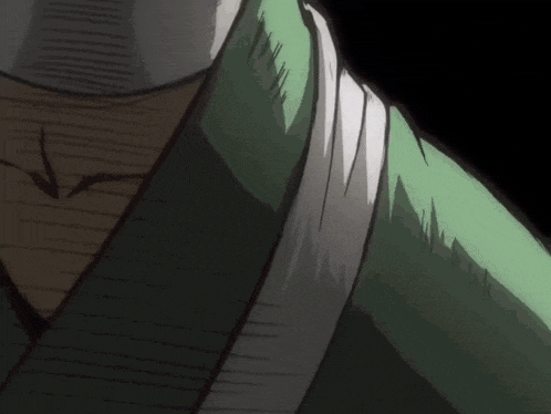 a close up of a person 's neck with a green shirt