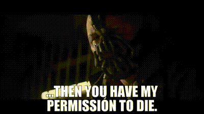 a man is holding a piece of paper in his hands and says then you have my permission to die .
