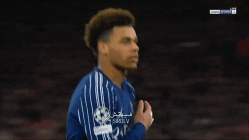 a soccer player in a blue jersey with the word sirdly on it