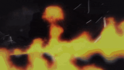 a close up of a fire with smoke coming out of it
