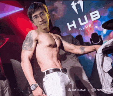 a man without a shirt is standing in front of a sign that says hub club