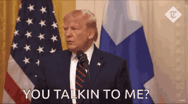 donald trump speaking into a microphone with the words " you talkin to me " below him