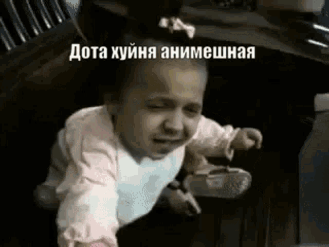 a baby is crying while sitting on a chair in a car .