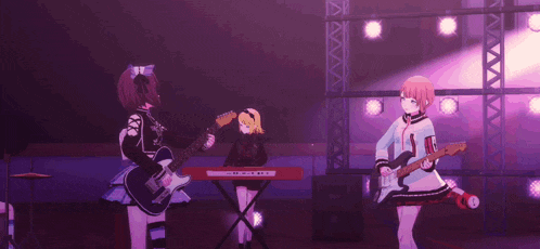 two anime girls are standing next to each other on a stage .