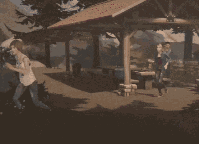 a group of people are standing under a gazebo