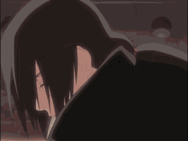 a close up of a cartoon character 's eye with a red pupil