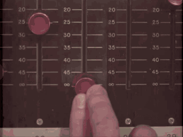 a close up of a person 's hand playing a guitar