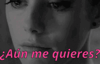 a black and white photo of a woman 's face with the words `` aún me quieres '' written in pink .