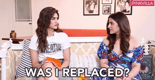 two women sitting on a couch with the words " was i replaced "