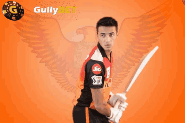 a man holding a cricket bat in front of a gully bet logo