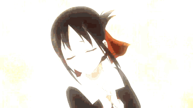 a girl with her eyes closed looks at another girl with her eyes closed