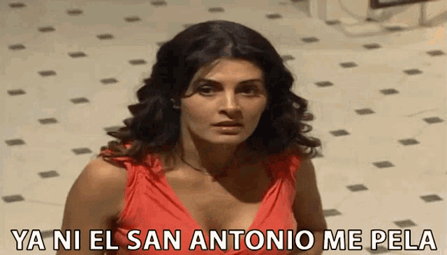 a woman in a red dress with the words ya ni el san antonio me pela