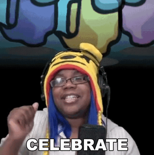 a woman wearing a tiger hat and glasses says celebrate in front of a microphone