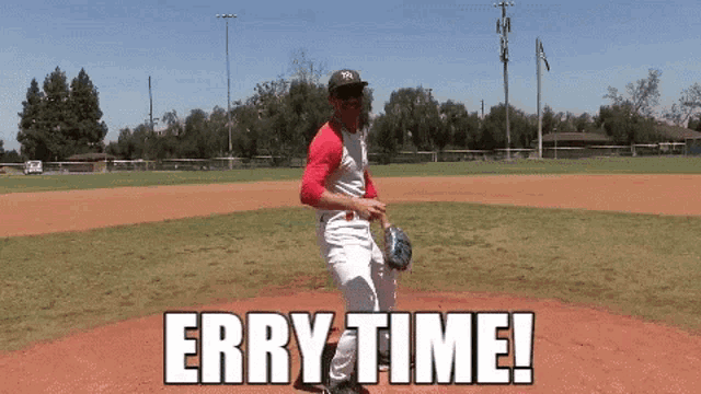 a man in a ny hat is throwing a baseball on a field with the words erry time behind him