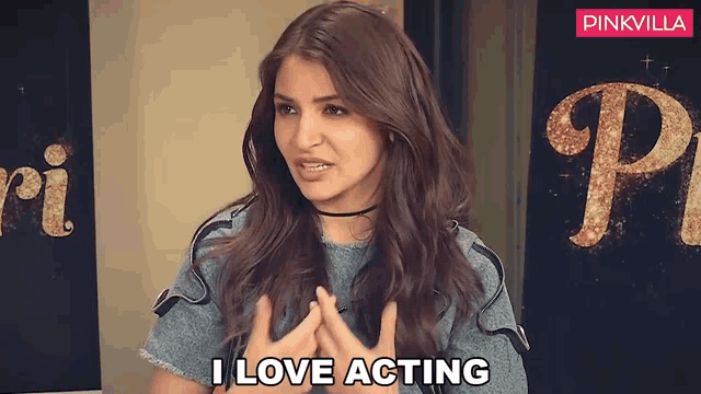 a woman says i love acting in front of a sign