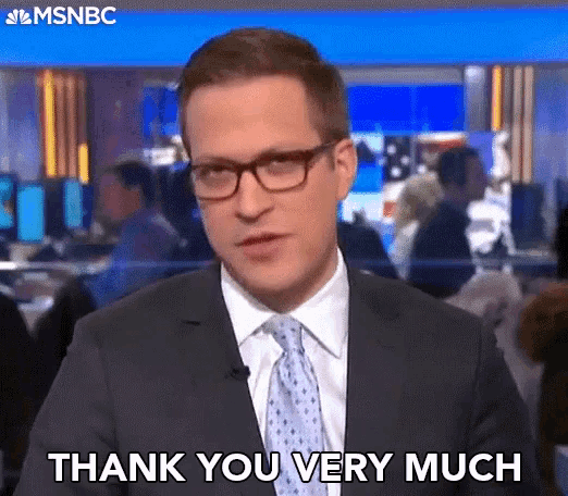 a man in a suit and tie is giving a thank you very much speech .