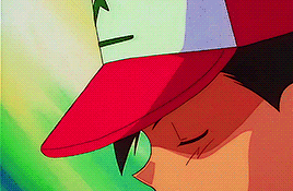 a close up of a person wearing a red hat with the letter n on it