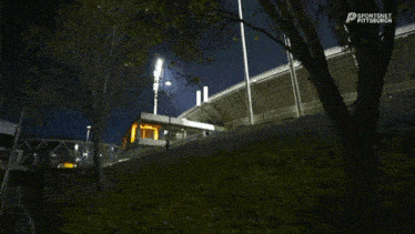a sportsnet pittsburgh logo is displayed above a stadium at night