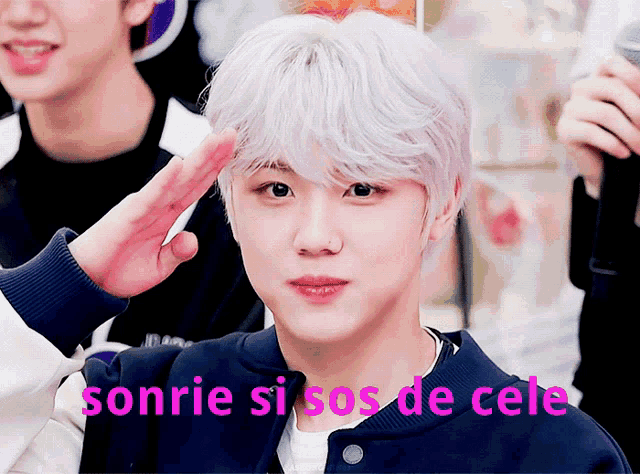 a young man salutes with the words sonrie si sos de cele